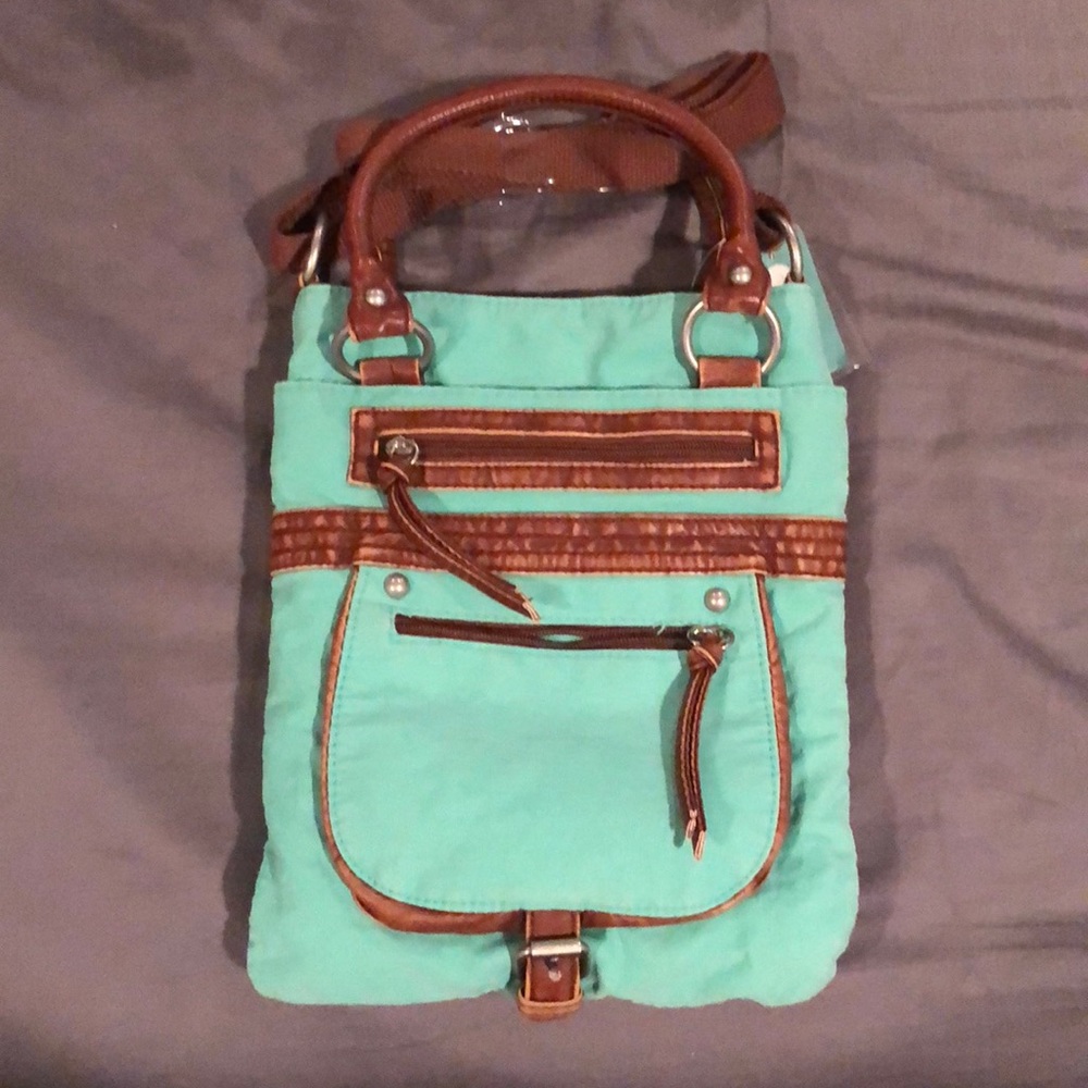 Brand New with tags Turquoise crossbody purse.